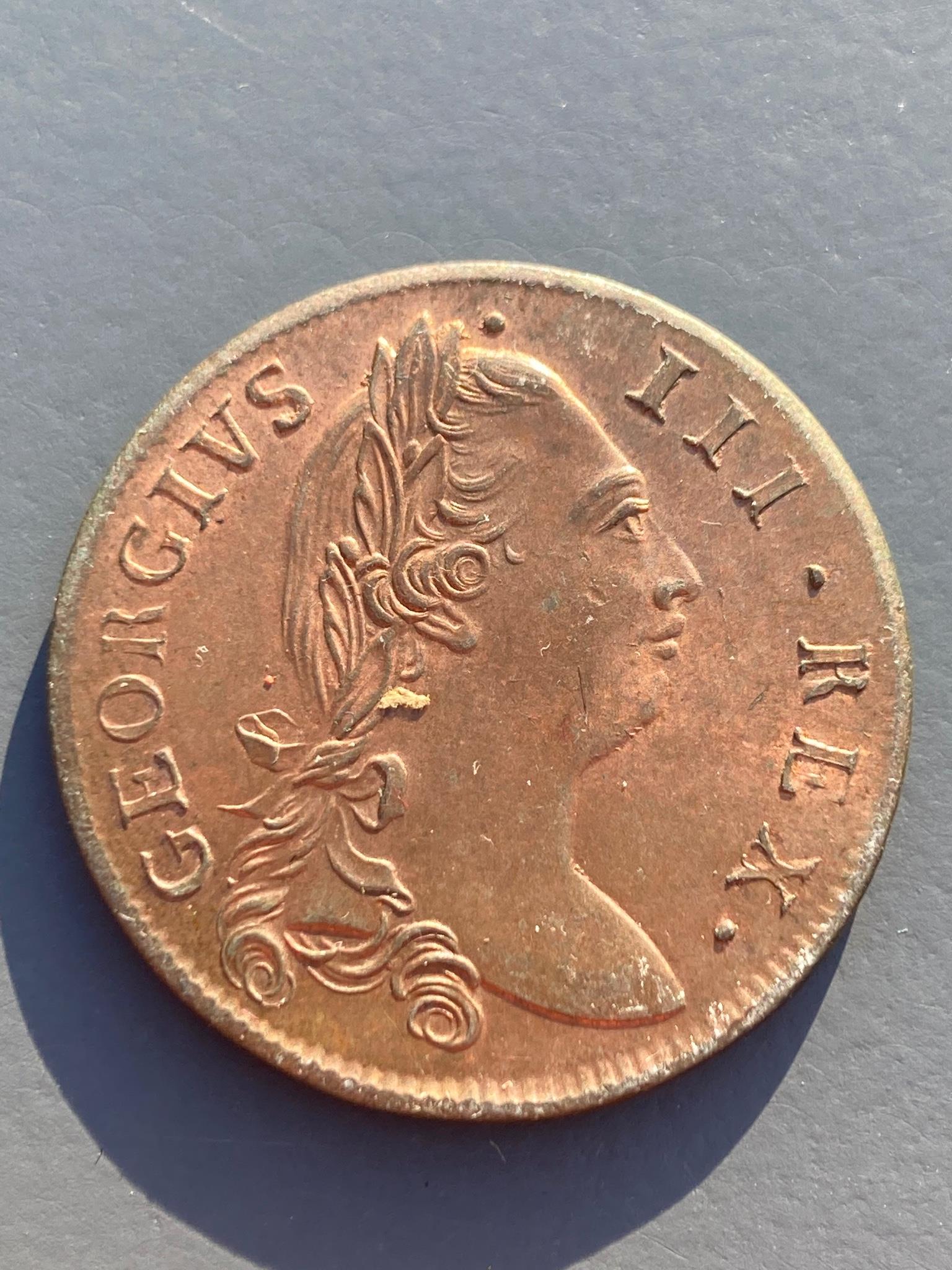 Ireland coins, a George III Irish Halfpenny, 1775, Type III, laureate bust with long hair, rev. crowned harp (DF 584; S.6614), weakness to edge otherwise about uncirculated, with some original lustre